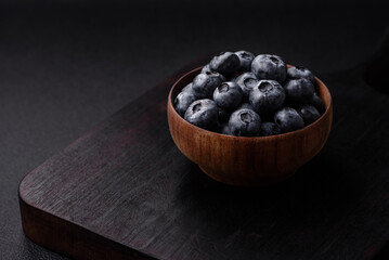 Delicious fresh sweet blueberries in a ceramic bowl. Vegan food