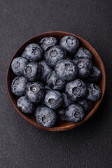Delicious fresh sweet blueberries in a ceramic bowl. Vegan food