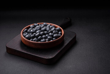 Delicious fresh sweet blueberries in a ceramic bowl. Vegan food