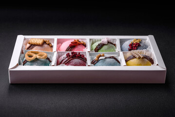 Delicious sweet colorful mochi desserts or ice cream with rice dough and toppings