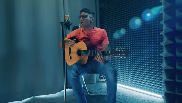 Recording studio with an african performer playing the guitar