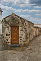 Fototapeta na wymiar old stone house with wooden door in the village