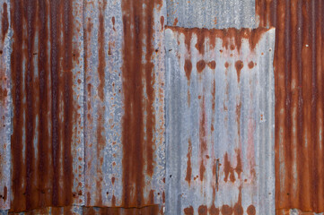 Old rusty zinc fence wall surface grunge, vintage style metal sheet roof for texture and background in retro concept