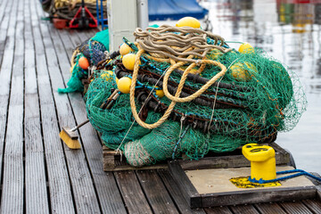 Fishing nets for sea fishing on the boards of the pier.