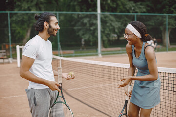 Two tennis players with rackets in hands before the match