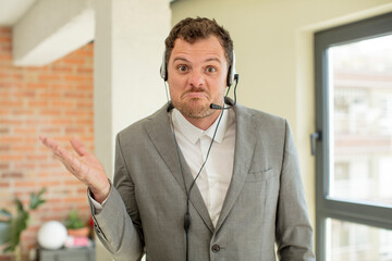 shrugging, feeling confused and uncertain. telemarketer concept