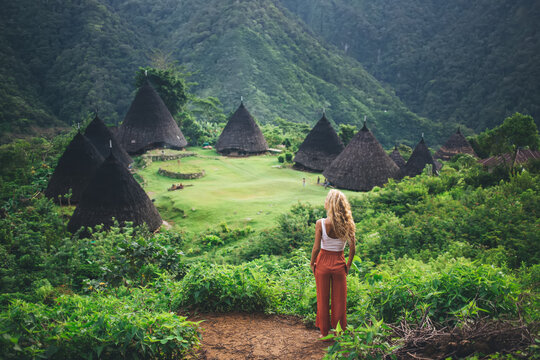 Female tourist at Wae Rebo village in mountainous