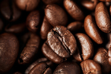 close up, black coffee beans in wooden box, dark roast, caffeine and energy, coffee background