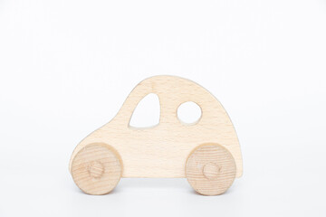 Small old wooden car on a white background