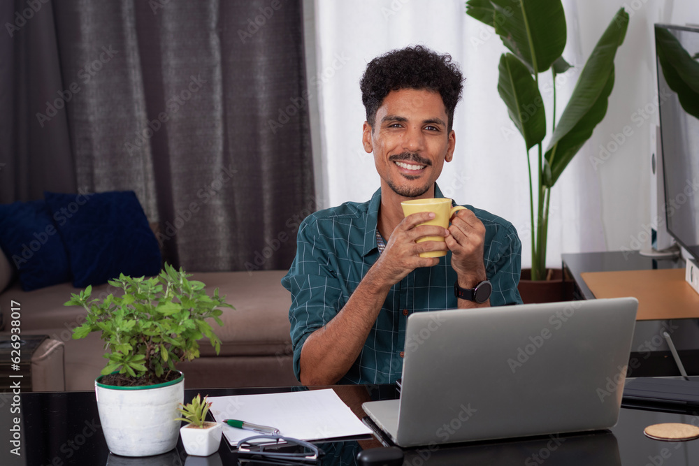 Wall mural Brazilian Black Business Man Working at Home. Young Man Doing Home Office During the day at desk With Laptop