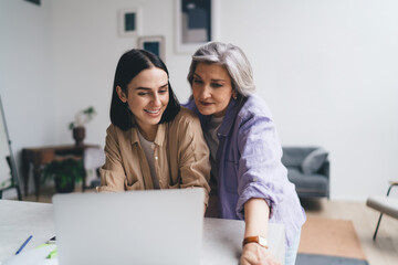 Diverse women working on project in creative office