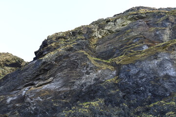 View on Reynisdrangar which are basalt sea stacks situated under the mountain Reynisfjall near the village Vík í Mýrdal in southern Iceland.