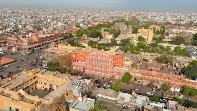 Jaipur, India: Aerial view of capital and largest city of Rajasthan, famous palace The Hawa Mahal, built from red and pink sandstone - landscape panorama of South Asia from above