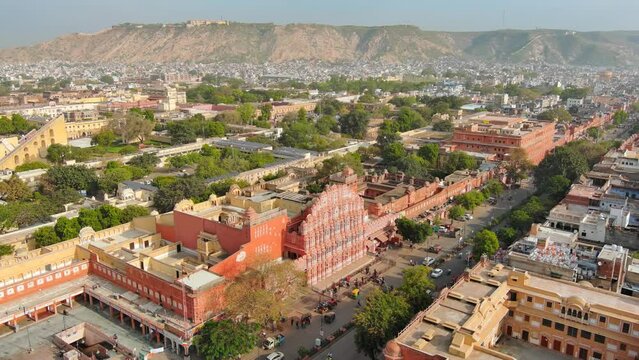 Jaipur, India: Aerial view of capital and largest city of Rajasthan, famous palace The Hawa Mahal, built from red and pink sandstone - landscape panorama of South Asia from above