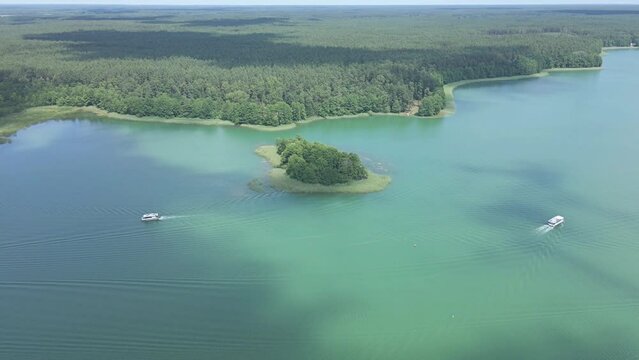 Aerial view of cruise ships sailing on the lakes in Augustow on a summer,sunny day.