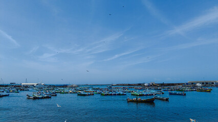 Vizhinjam fishing harbor, Thiruvananthapuram, Kerala, bright blue sky, seascape view