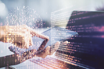 Creative concept of code skull illustration and finger clicks on a digital tablet on background....