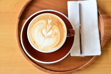 high angle view of coffee cup on wood grain table Drinking Concept: Hot Coffee, Latte, Espresso, Cappuccino