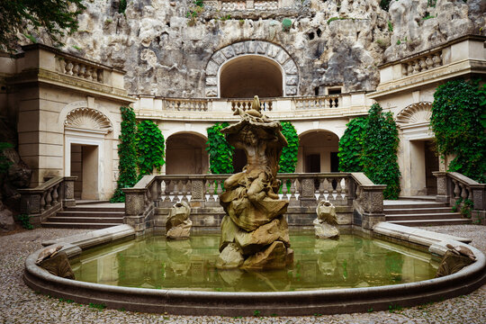 Prague, Czech Republik - June 23, 2023: Statue of Neptune, Grotta fountain in Grebovka, Havlicek Gardens, Havlickovy zahrady, Praha, Czechia - Sculpture of mythical god. High quality photo
