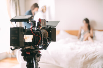 Professional cinema and video camera on the set. Shooting shift, lighting fixtures, shooting equipment and the team.