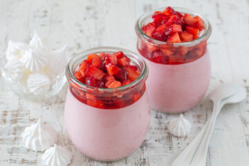 strawberry mousse dessert in glass with meringues