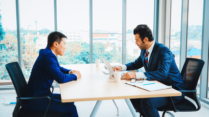 Job seeker in job interview meeting with manager and interviewer at corporate office. The young...
