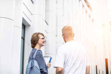 colleagues communicate after work and discuss working moments, Young IT specialists, 
Corporate culture