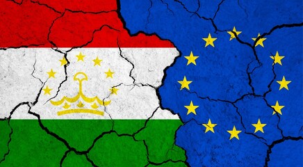 Flags of Tajikistan and European Union on cracked surface - politics, relationship concept
