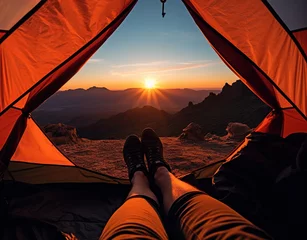two feets under tent in the sunset on the moutain © Yi_Studio