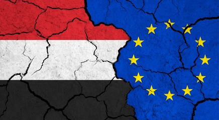 Flags of Yemen and European Union on cracked surface - politics, relationship concept