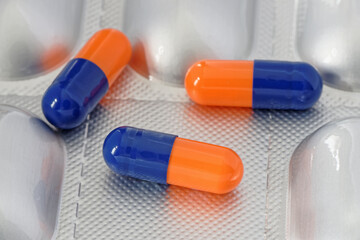 Close up of a Group of Colorful Pills or Capsules. Statins. Antibiotics.