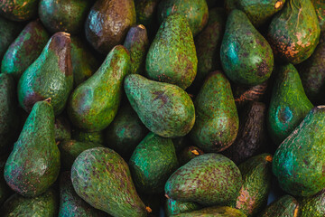 Close-up view of avocados in the market.