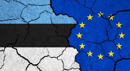 Flags of Estonia and European Union on cracked surface - politics, relationship concept