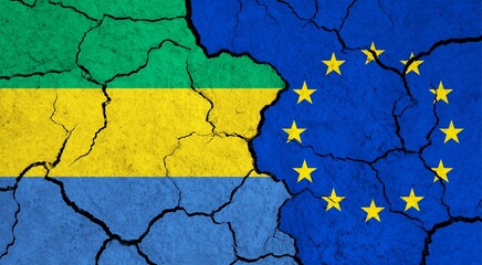 Flags of Gabon and European Union on cracked surface - politics, relationship concept