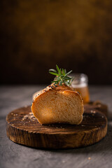 Artisan bread whole wheat baguette white milk and honey on rustic wooden board and abstract table. Sourdough bread
