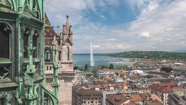 Geneva (Geneve) Switzerland time lapse 4K, high angle view city skyline timelapse at Lake Geneva and Jet d'eau fountain with tower of Saint Pierre Cathedral