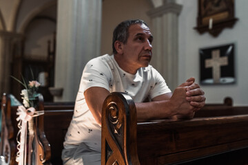 man praying in church