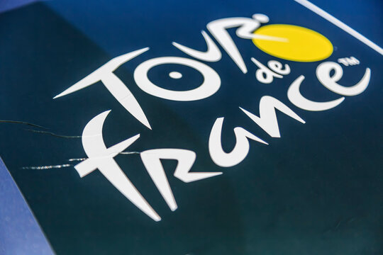 Culoz, France - July 14th, 2023: Close-up of the Tour de France logo displayed on a car during the stage 13th of Le Tour de France 2023.