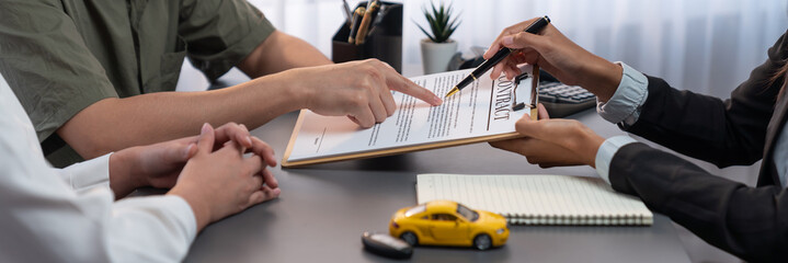 Car dealer calculate interest rate and costs of car loan, offering financial and insurance service...