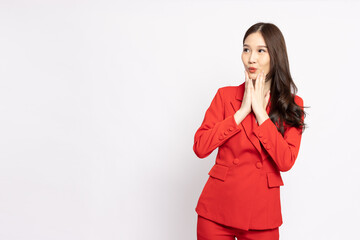 Portrait of excited Asian businesswoman in red suit isolated over white background, Wow and...