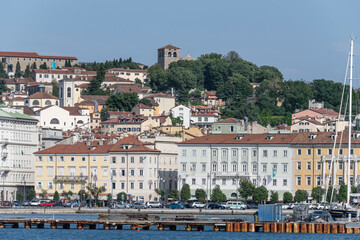 Fototapeta na wymiar town waterfront and san Giusto belltower, Trieste, Friuli, Italy