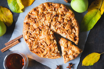 Apple pie with cinnamon. Charlotte, a sweet dessert made from apples baked in dough