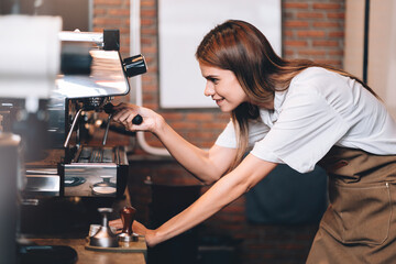 Professional Female Barista Making Hot Coffee with Coffee Machine in Cafe, Small Business Owner Working in Bar and Restaurant.