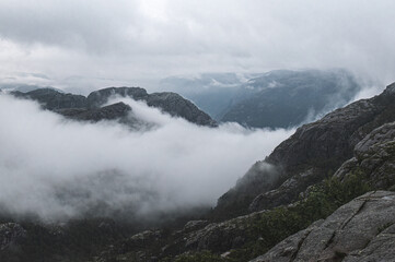 Fototapeta na wymiar Mountain landscape with clouds and fog in Norway, Scandinavia