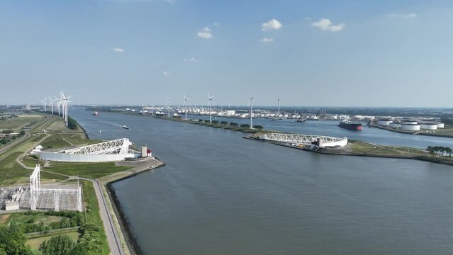 The Maeslantkering is a storm surge barrier that was commissioned in 1997 on the border of Het Scheur and the Nieuwe Waterweg near Hoek van Holland.