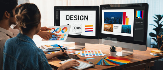Graphic designer work on computer laptop and with graphic drawing pen while brainstorming unique...