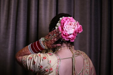 ndian Bridal Hairstyle with flower