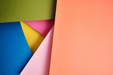 Abstract texture of colored paper. Geometric shapes and lines in bright colors. Place for text. Multicolor abstract flat lay. Back to school concept. Copy space, top view