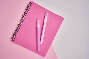 Top view of blank notepads, pen and markers. Mockup. The concept of office and school supplies, school year