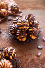 marble Madeleine on rusty table background.